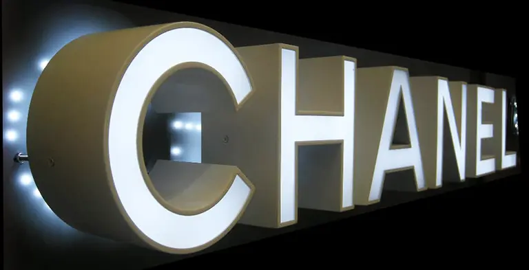 Photo of the framed frontlit channel letters sign used by Chanel in the storefront.