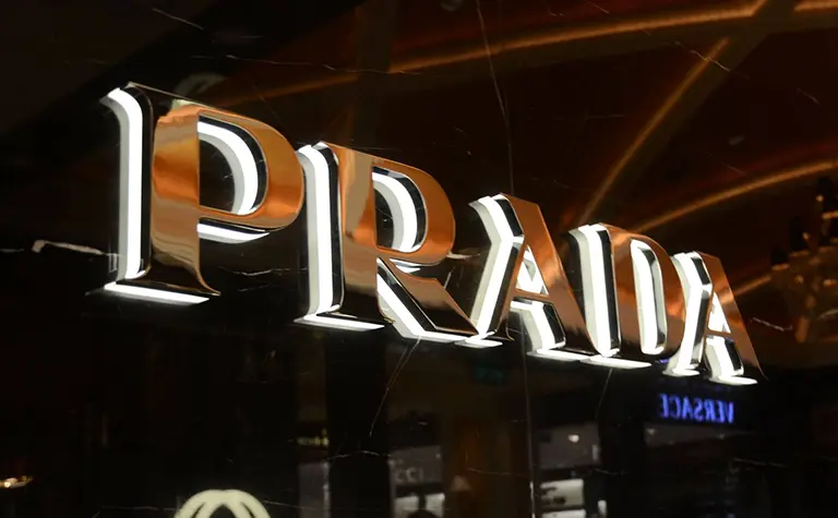 A photo of the Prada brand's side lit channel letters sign.