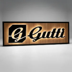 Custom halo-lit channel letters mounted on a wood-grain backer panel.
